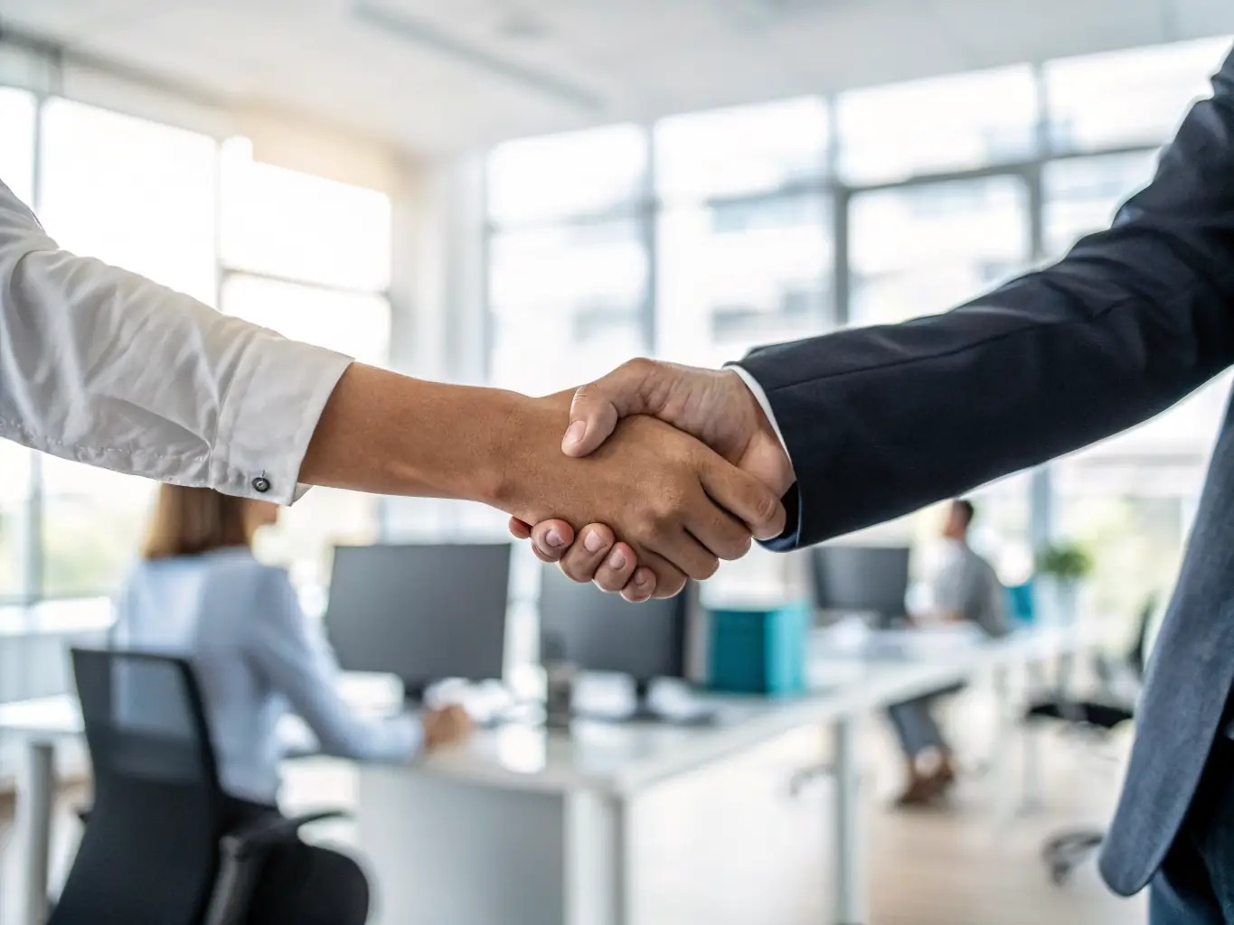 Two representatives from LINE ET LILI and a corporate partner shaking hands, symbolizing a collaborative partnership to support community initiatives.